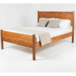 Bed frame named Hayden - shown with minimal white bedding